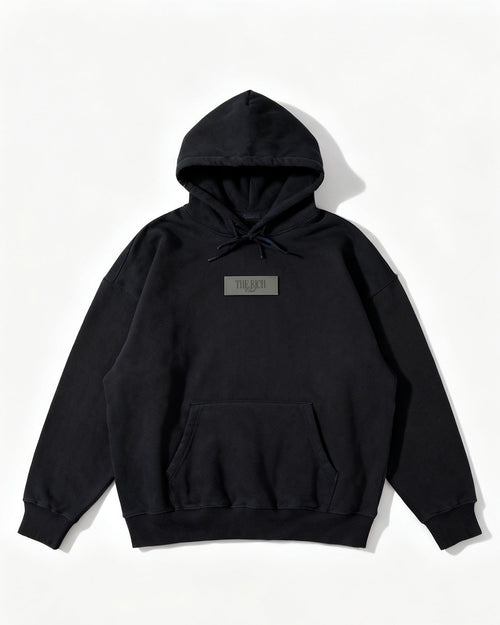 Heavyweight Hoodie in Black, flat lay. AI placeholder v2 (pre-production preview, not the final product)