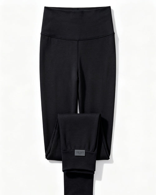 Essential Leggings in Black, flat lay. AI placeholder v2 (pre-production preview, not the final product)
