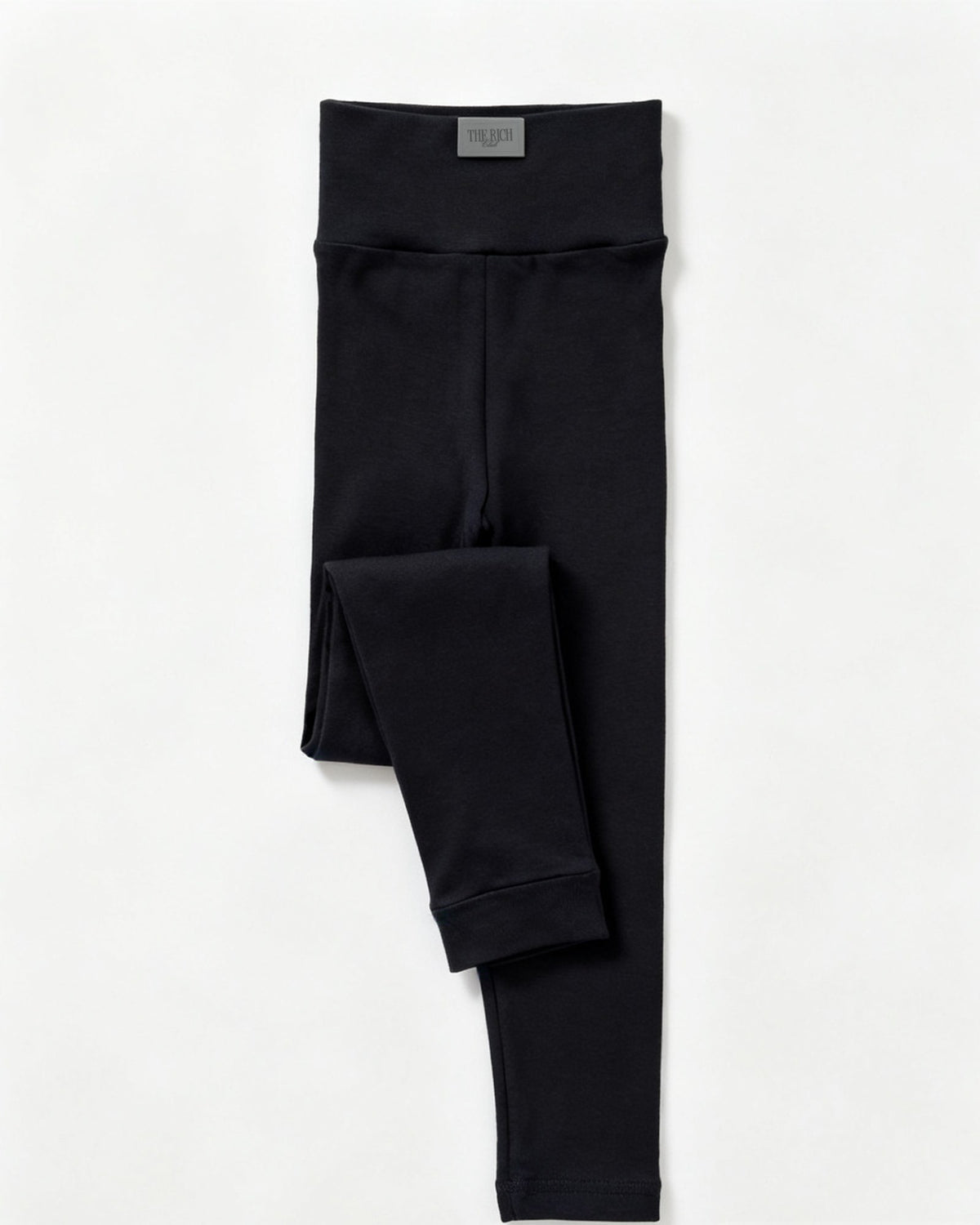 Essential Leggings (Kids) in Black, flat lay. AI placeholder v2 (pre-production preview, not the final product)