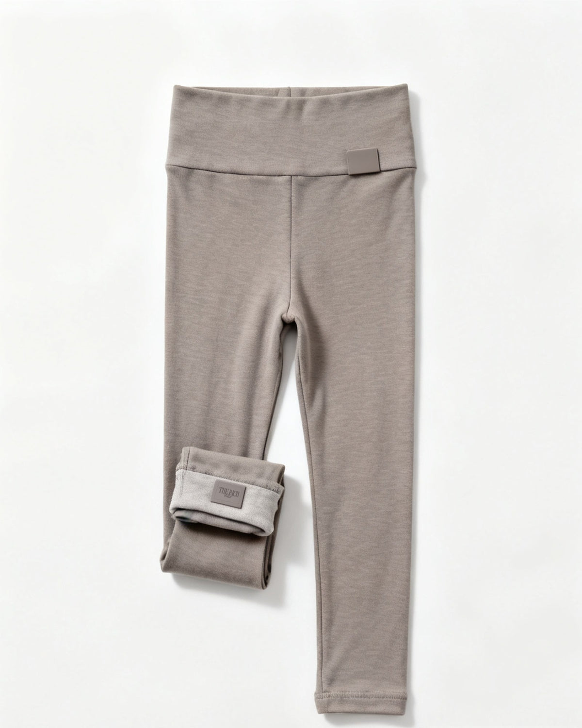 Essential Leggings (Kids) in Grey, flat lay. AI placeholder v2 (pre-production preview, not the final product)