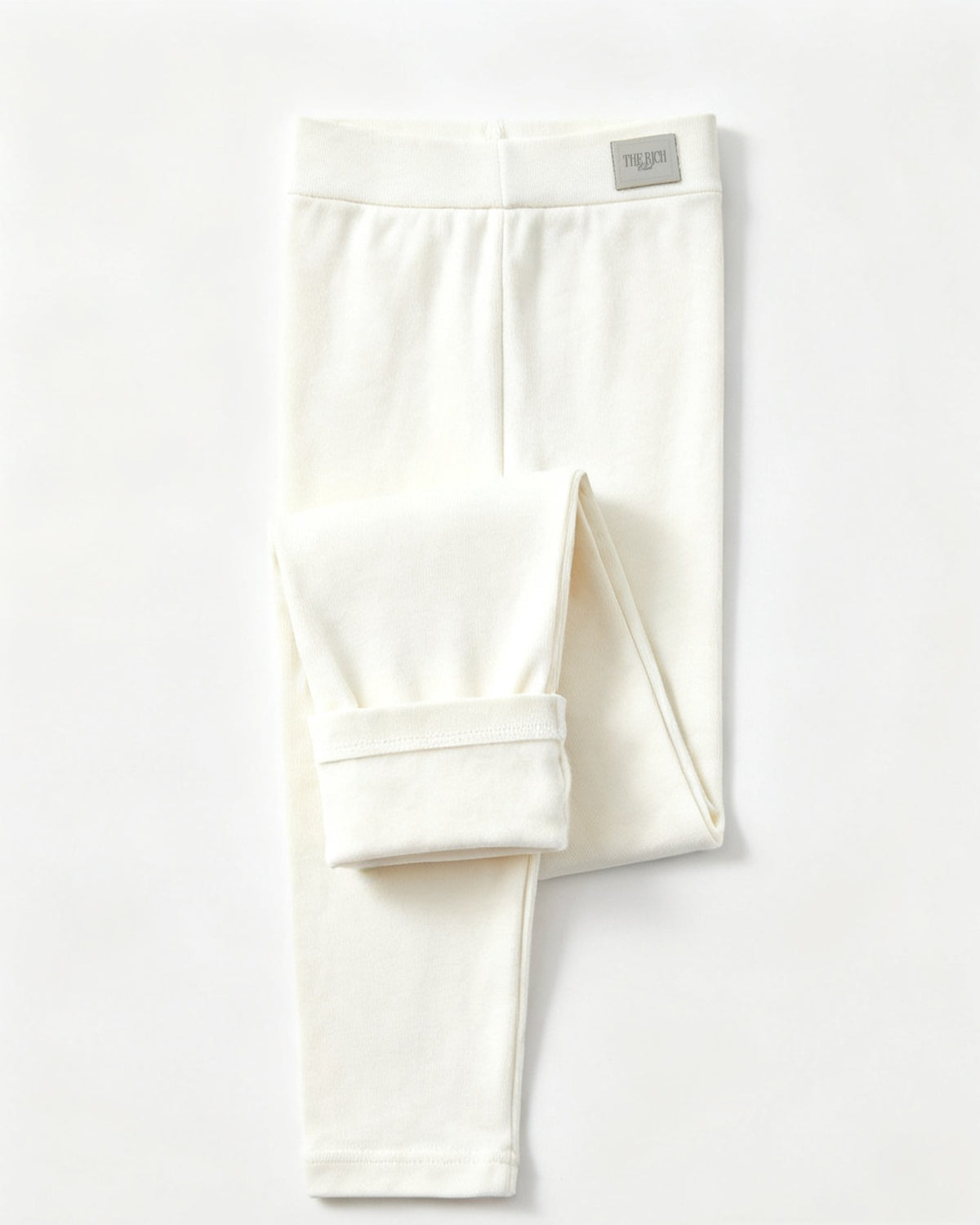 Essential Leggings (Kids) in White, flat lay. AI placeholder v2 (pre-production preview, not the final product)