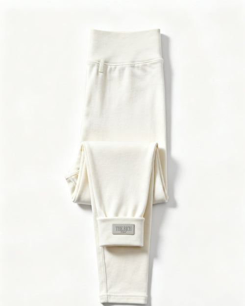 Essential Leggings in White, flat lay. AI placeholder v2 (pre-production preview, not the final product)