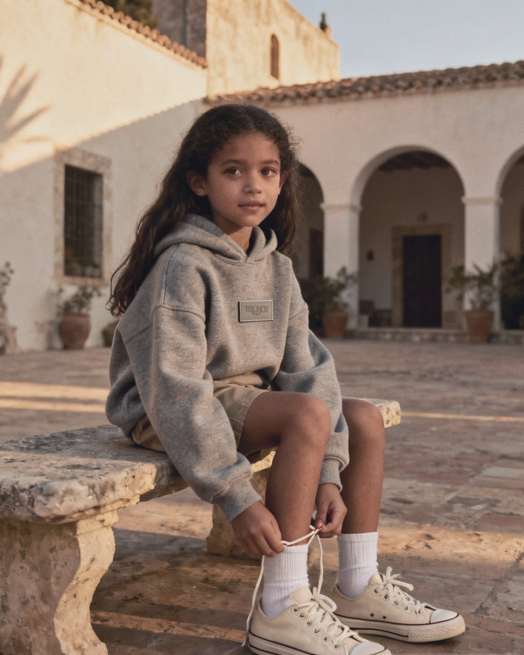 Heavyweight Hoodie (Kids) worn, lifestyle. AI placeholder v2 (pre-production preview, not the final product)