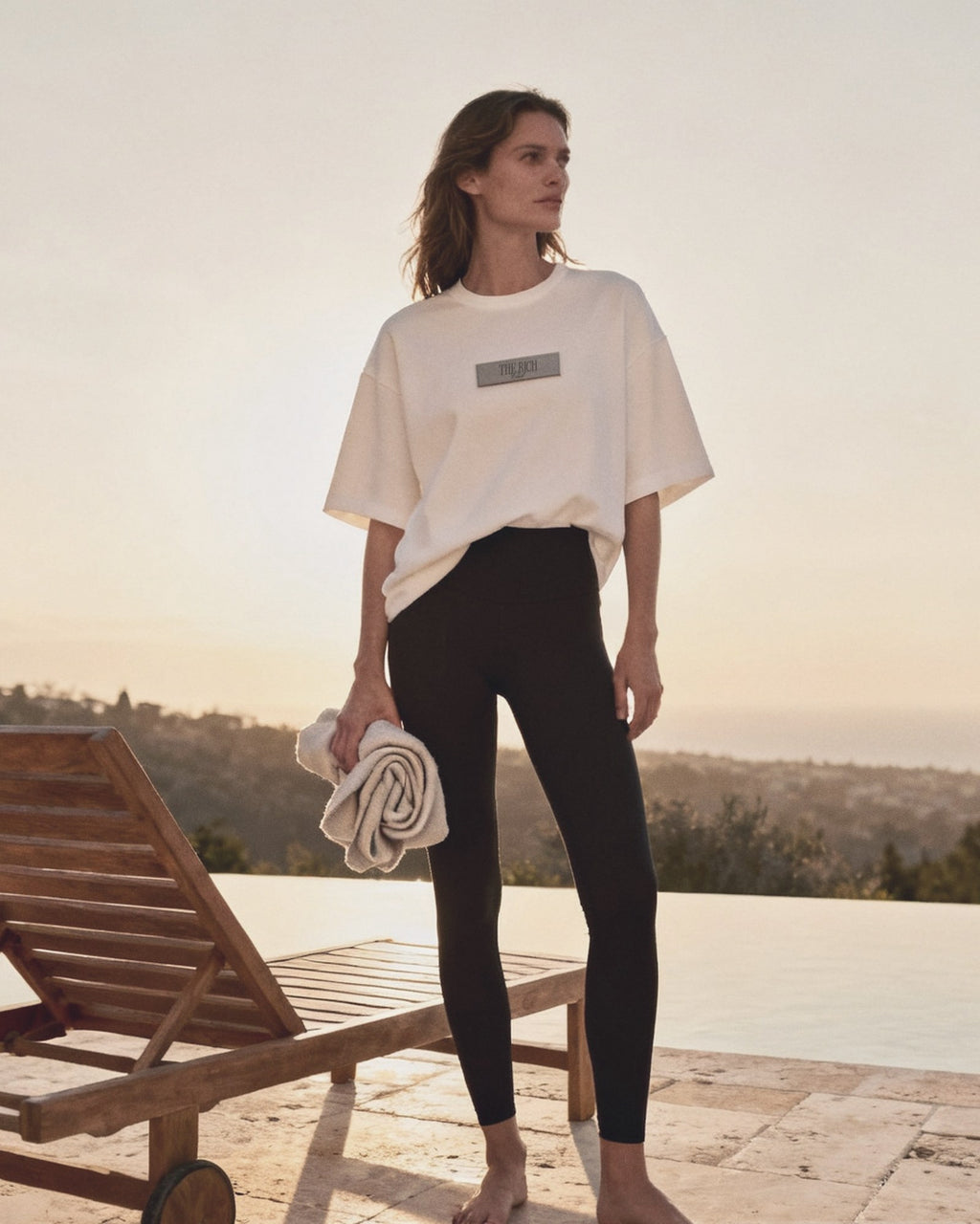 Essential Leggings worn, lifestyle. AI placeholder v2 (pre-production preview, not the final product)