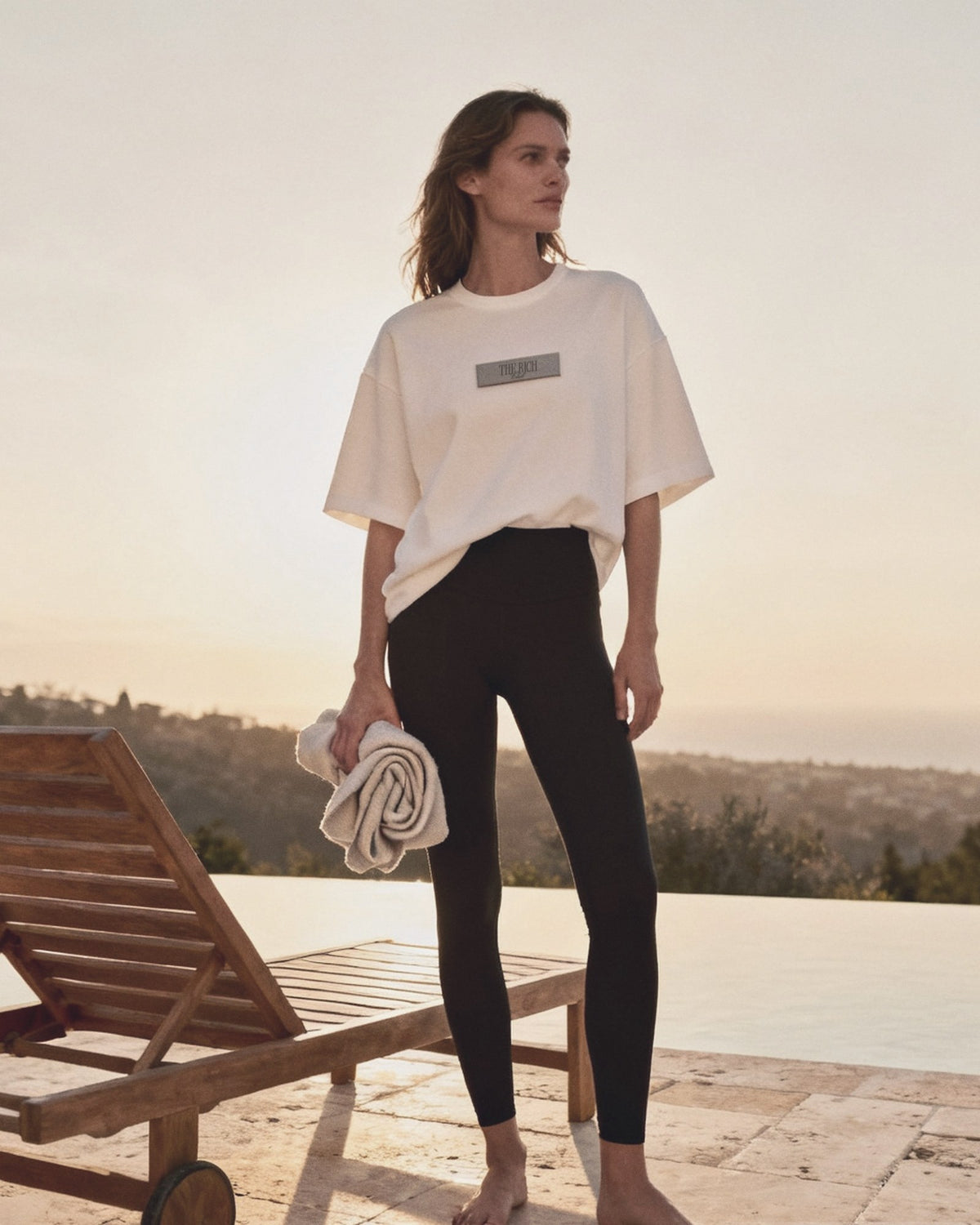 Essential Leggings worn, lifestyle. AI placeholder v2 (pre-production preview, not the final product)