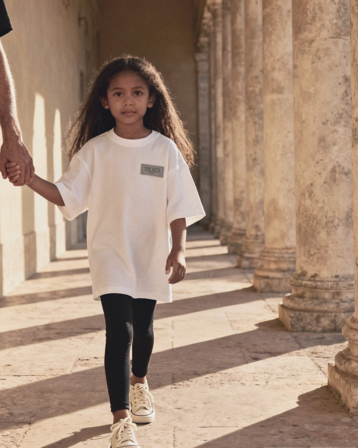 Essential Leggings (Kids) worn, lifestyle. AI placeholder v2 (pre-production preview, not the final product)