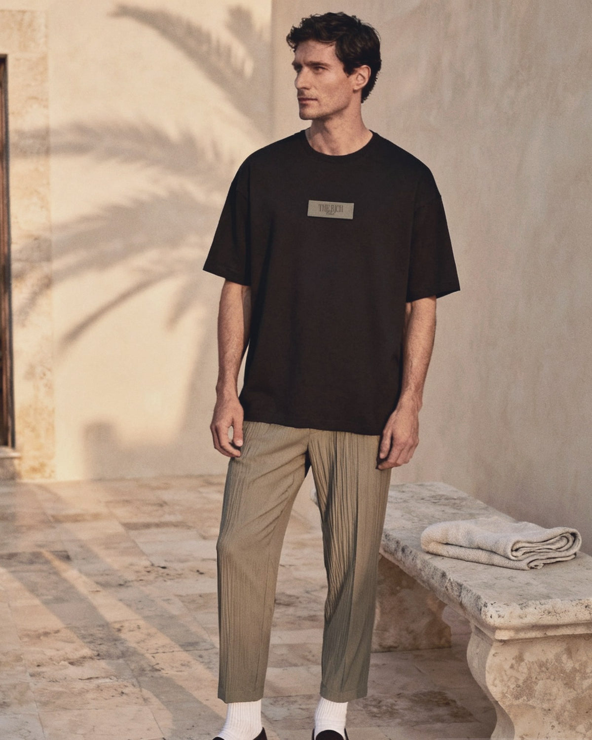 Heavyweight Tee worn, lifestyle. AI placeholder v2 (pre-production preview, not the final product)