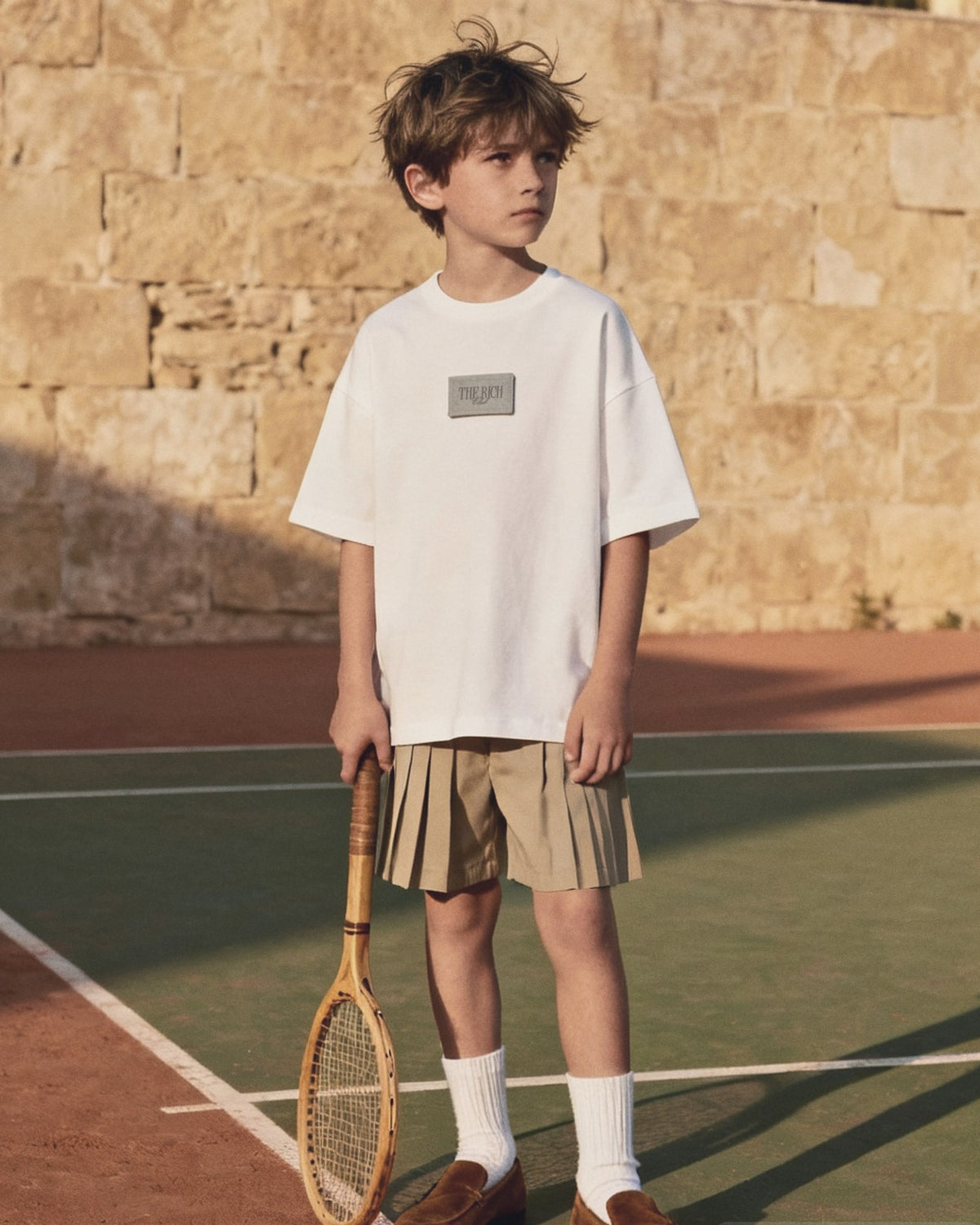Heavyweight Tee (Kids) worn, lifestyle. AI placeholder v2 (pre-production preview, not the final product)